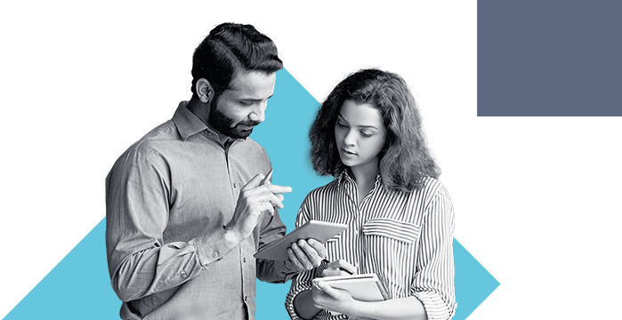 A man and woman looking over their business account through the Stellar Bank Mobile App